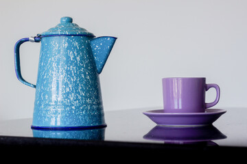 Elegant and traditional design of teapot and coffee cup in set isolated on white background