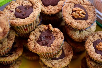 Closeup of muffins with raisins and walnuts.