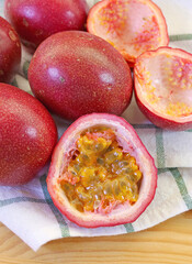 Heap of Fresh Ripe Passion Fruits on Checkers Dish Towel