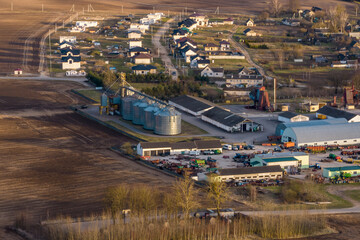 aerial panoramic view on agro-industrial complex with silos and grain drying line for drying cleaning and storage of agricultural products