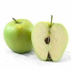 Closeup shot of a freshly cut green apple isolated on white background