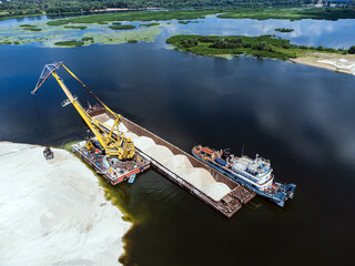 Aerial view of the loading of dry cargo ships with crushed stone.
