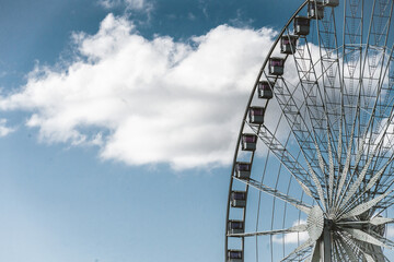 ferris wheel on a blue sky in a park