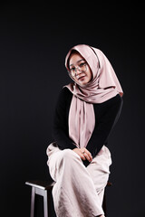 Cute young Asian hijab corporate girl with smooth glowing skin smiling and relaxing over an isolated background studio. Beauty skin care, office concept.