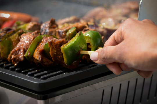 view of beef being cooked on a griddle