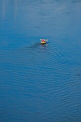 Man kayaking in River Axe in East Devon, UK