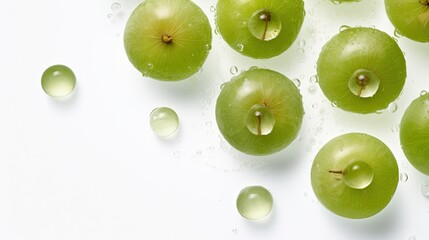 Fresh amla, Indian gooseberry with water drops on a white background, top view