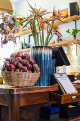 Loft design of interior with passion fruits and decor near cashier counter and menu