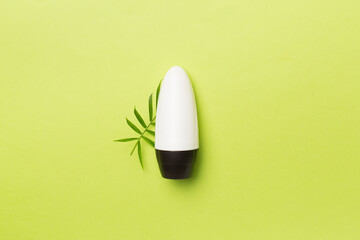 Natural deodorant on color background, top view