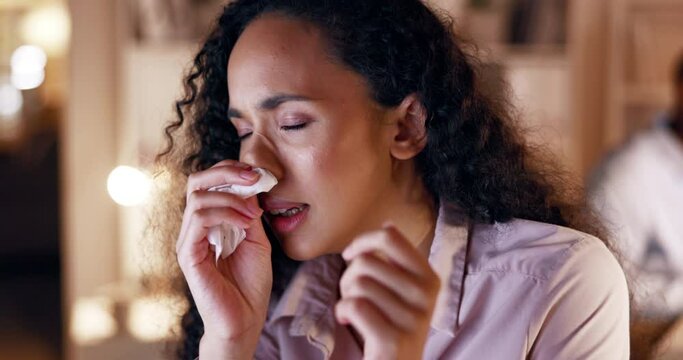 Business woman, sneeze and tissue in night at office with flu, sick and blowing nose for health at job. Young businesswoman, allergy and toilet paper for cleaning, covid or cold in dark workplace