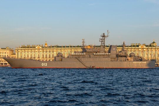 PETERSBURG, RUSSIA - JULY 26, 2021: Big landing ship "Olenegorskiy gornyak" against the background of the Winter Palace on a sunny July evening. Preparations for Navy Day celebrations