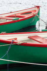 Fototapeta na wymiar Collioure, Occitania France - June 8, 2022: Close up of Catalan boats moored at the medieval port