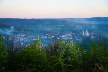 morning fog above a village in Romania.