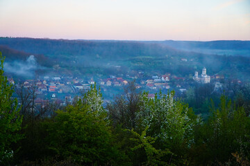 morning fog above a village in Romania.
