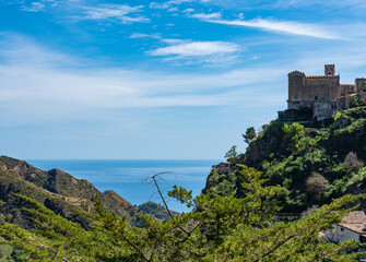 Fototapeta na wymiar panorama of the Ionian Sea seen from the heights of Savoca, a town in western Sicily, with an ancient castle to the right, on a clear sunny day