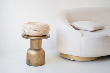 Part of a bright interior with a coffee table and a beige sofa. Stylish minimalism in the interior, natural materials,. High quality photo