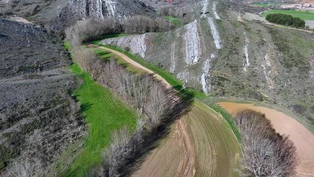 Landscape of crops and reliefs in Renedo de la Inera. Aerial view from a drone. World geological heritage UNESCO. Las Loras Geopark. Palencia. Castile and Leon. Spain, Europe