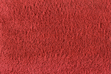 texture of red terry cloth fabric. close up of a towel terry cloth