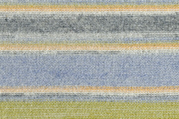 The texture of a knitted wool light pastel.