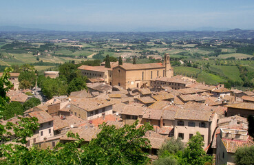 Fototapeta na wymiar Old medieval town, church and countryside of San Gimignano, Tuscany, Italy