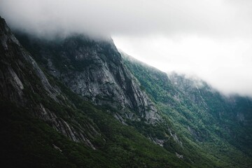 Beautiful shot of rocky mountain with a mist