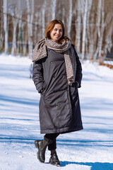 Smiling woman in full growth. Girl in winter. vertical 