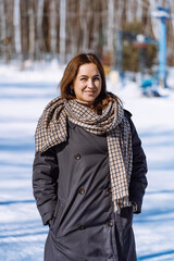 Smiling woman in full growth. Girl in winter. vertical 