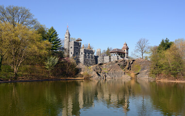 Belvedere Castle (1867-1869) on shore of Turtle Pond in Central Park on spring day, New York City