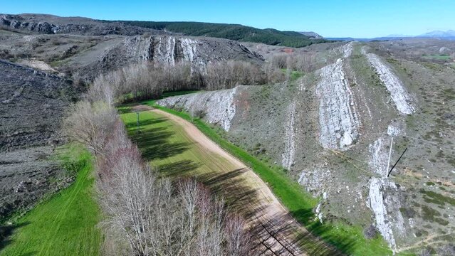 Landscape of crops and reliefs in Renedo de la Inera. Aerial view from a drone. World geological heritage UNESCO. Las Loras Geopark. Palencia. Castile and Leon. Spain, Europe