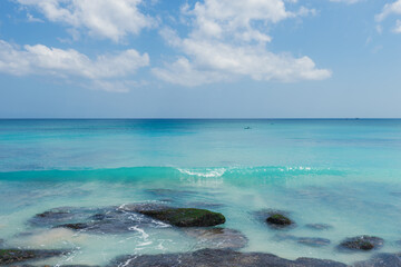 View of the sea from a tropical beach with an expressive sky. Beach in Bali, Indonesia - nature, recreation, background