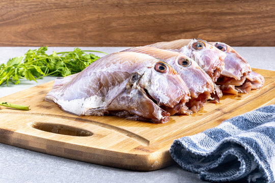 Fish "peroa" cleaned on the wooden board ready to fry. Traditional Brazilian beach food known as: "Peixe Frito Capixaba"