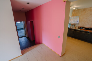 House interior with pink walls in the corridor