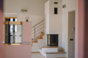 Empty room interior with fireplace and aquarium