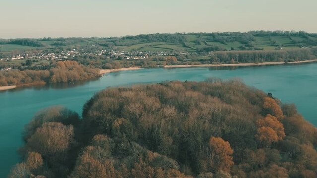 Aerial drone shot of blue water lake in countryside at Chew Valley Lake, Somerset