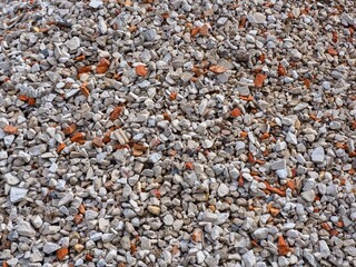 Background - Crushed construction debris. The use of recycled building materials at construction sites is an environmental solution.