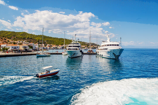 Second pier.  where  private luxury yachtsare  on Spetses  island in Greece  and speed motoboat (water taxi)  and track of  our hovercraft
