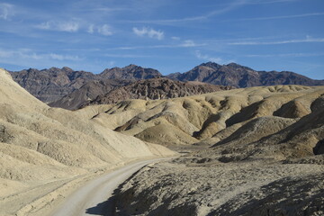 Fototapeta na wymiar Landscape in the Death Valley National Park: mountain road in the Twenty Mules Team Canyon