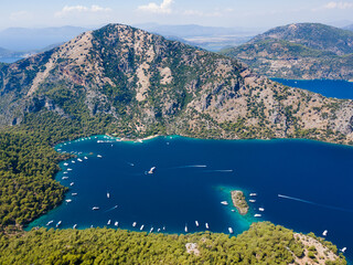 Aerial drone photo of  Hamam bay, located in the midst of G&ouml;cek and Dalaman, Fethiye. Daily tour boats and private yachts anchor to have serenity and enjoy the secluded bay.