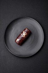 Delicious sweet cheese with syrup covered with chocolate and nuts