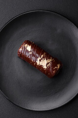 Delicious sweet cheese with syrup covered with chocolate and nuts