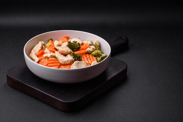 Delicious dish consisting of pieces of boiled chicken, broccoli and carrots