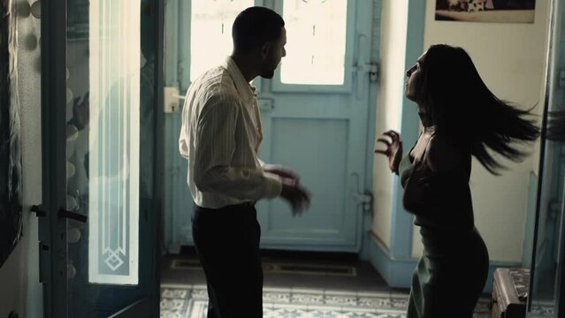 A couple engaged in a heated argument, shouting and displaying aggressive behavior towards each other. A distressed boyfriend and girlfriend experiencing conflict and tension in their relationship
