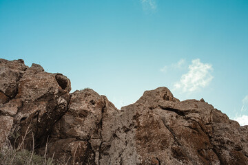 rocky landscape in the mountains and blue sky background 