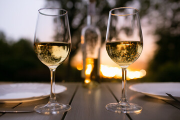 Romantic dinner setting with a beautiful nature sunset view 
