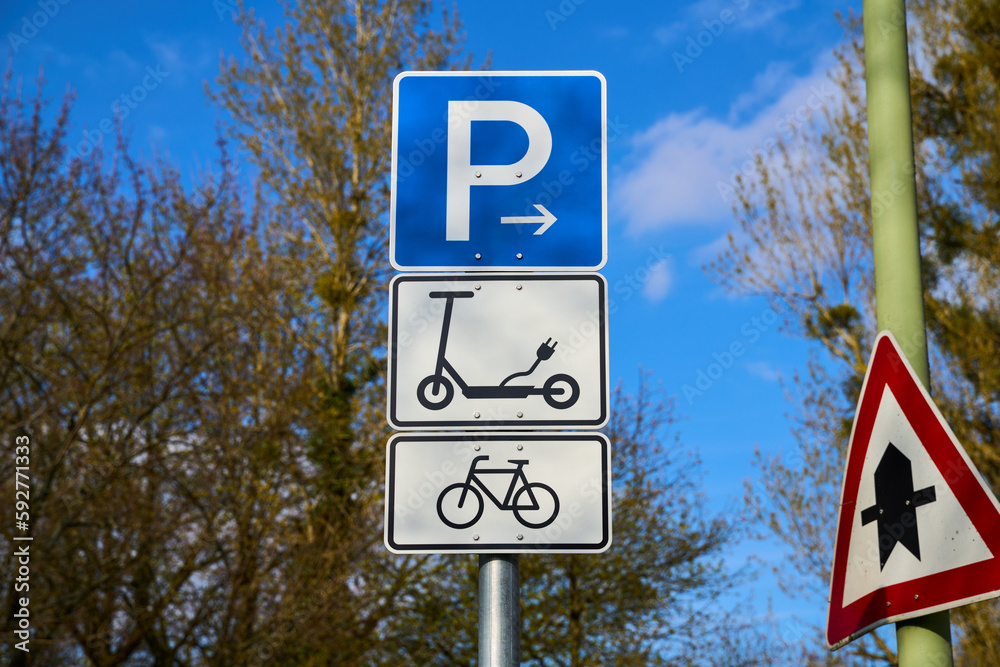 Wall mural traffic signs permitting the driving and parking of electric scooters and bicycles. street signs for