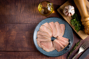 Sliced roast beef on plate.