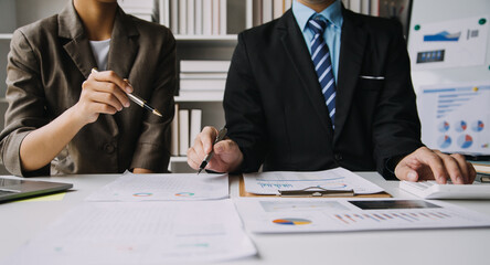 Businesswoman or accountant working Financial investment on calculator, calculate, analyze business and marketing growth on financial document data graph, Accounting, Economic, commercial concept.