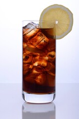 Cola on Ice in a Glas with a slice of lemon