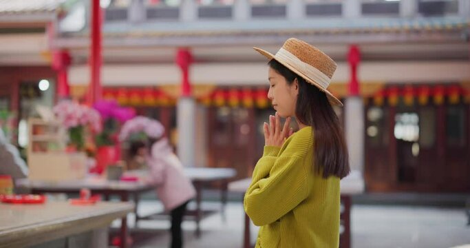 Woman pray in the chinese temple