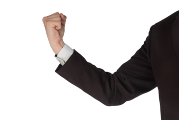 Podniesiona pięść białego biznesmena w ciemnej marynarce. Komunikacja niewerbalna.